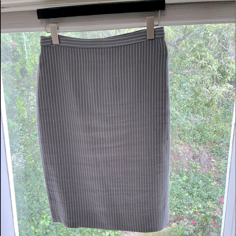 JCrew pencil skirt in light grey stripe. Fully lined. Zipper in back. Size 4.